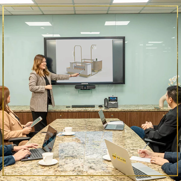 Professionals collaborating in office, framed by letter-shaped windows